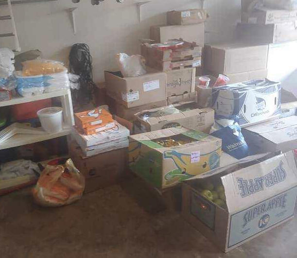 Arkansas Hunger Relief Alliance Boxes of food being sorted for community distribution